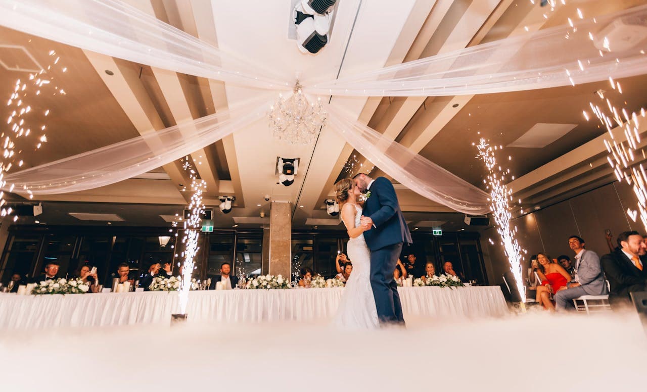Couple's first dance beneath sparklers