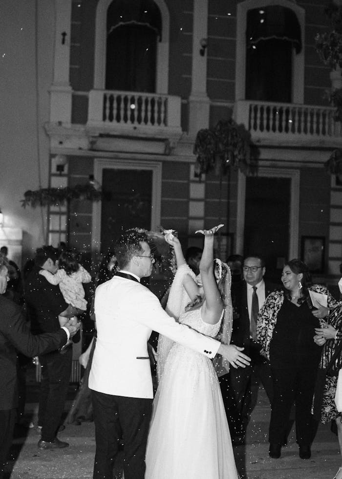 A romantic moment captured as a bride and groom dance at their outdoor wedding.
